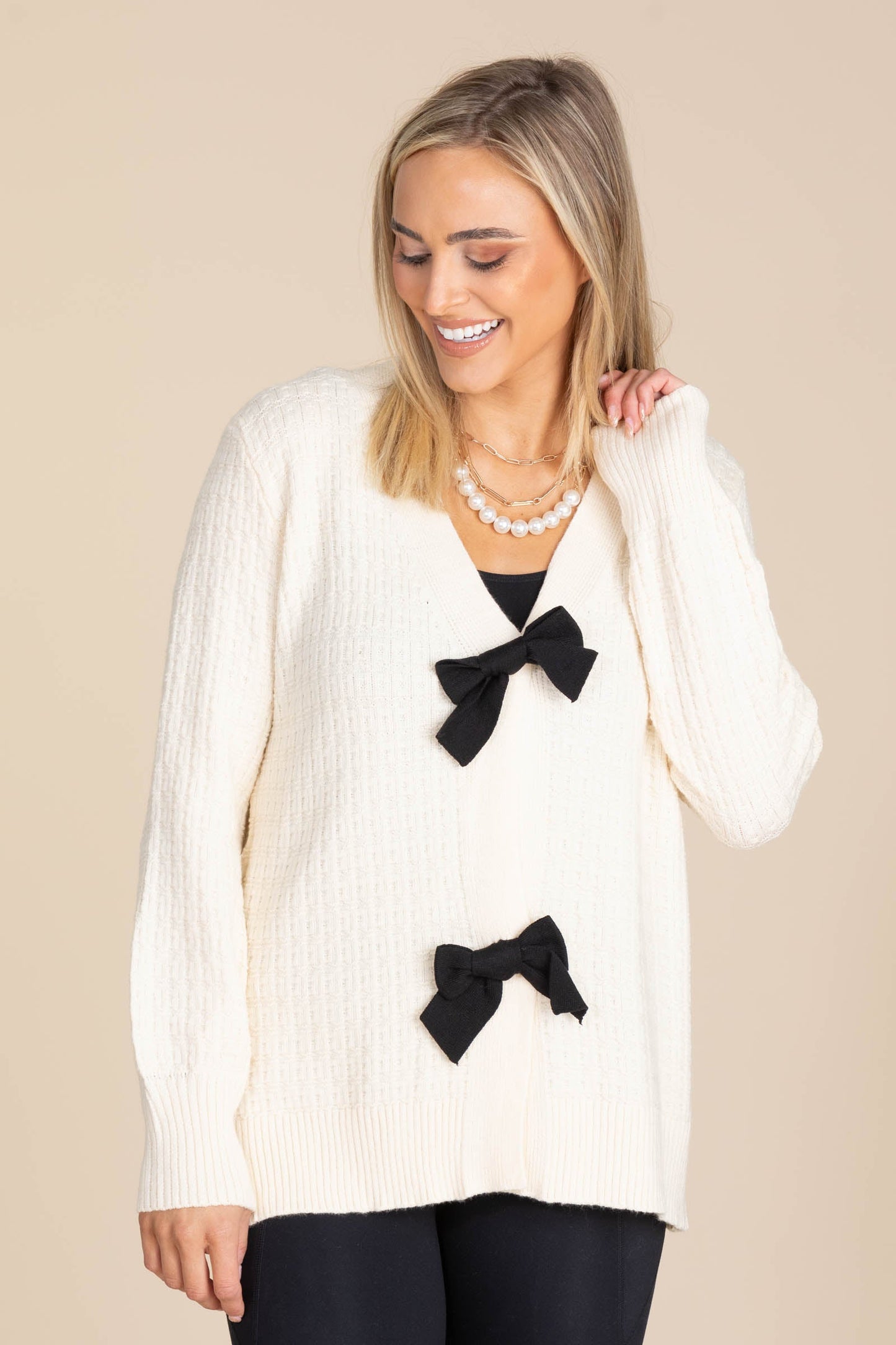 Cream Sweater Cardigan With Black Bows