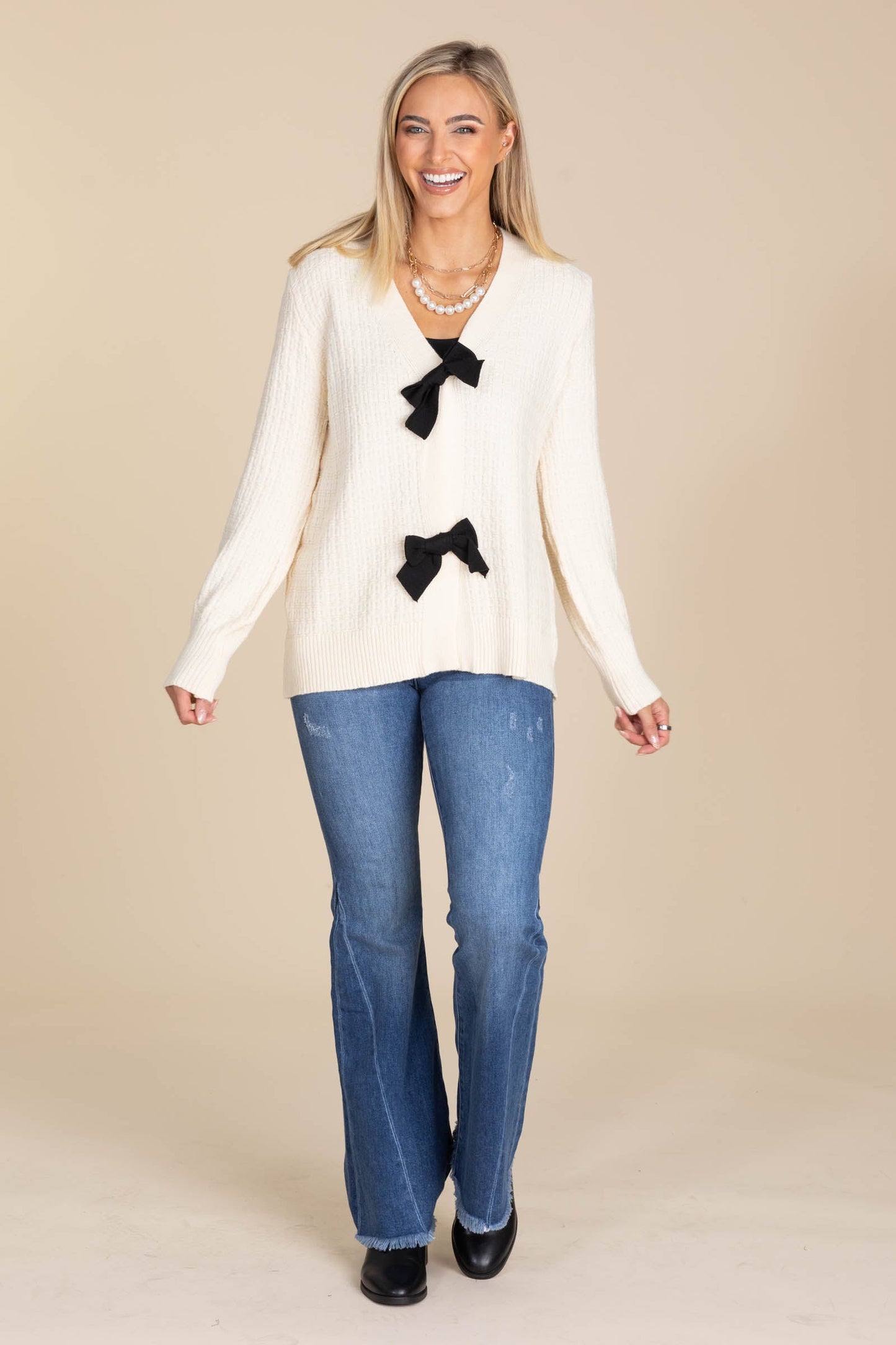 Cream Sweater Cardigan With Black Bows