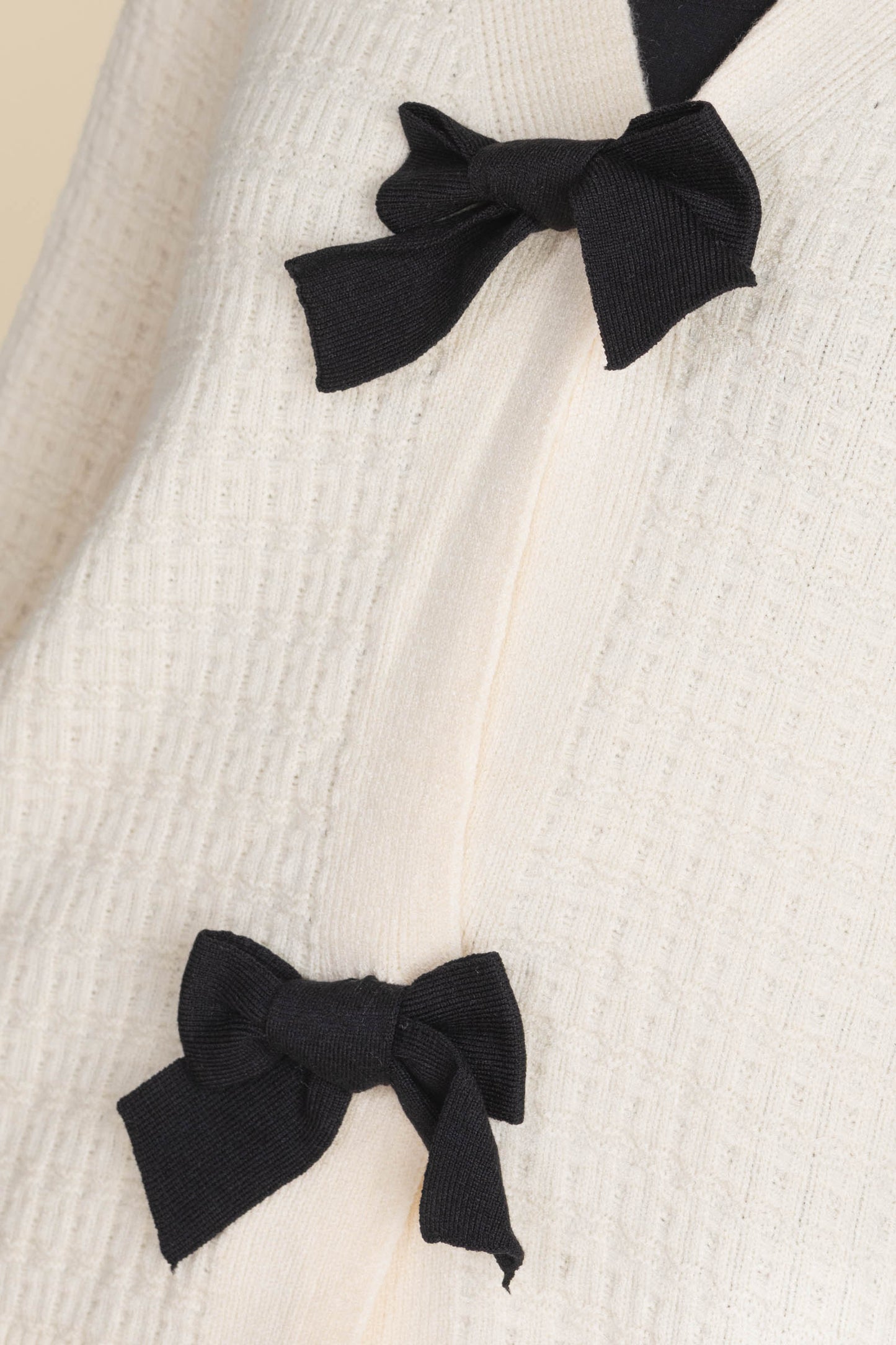 Cream Sweater Cardigan With Black Bows